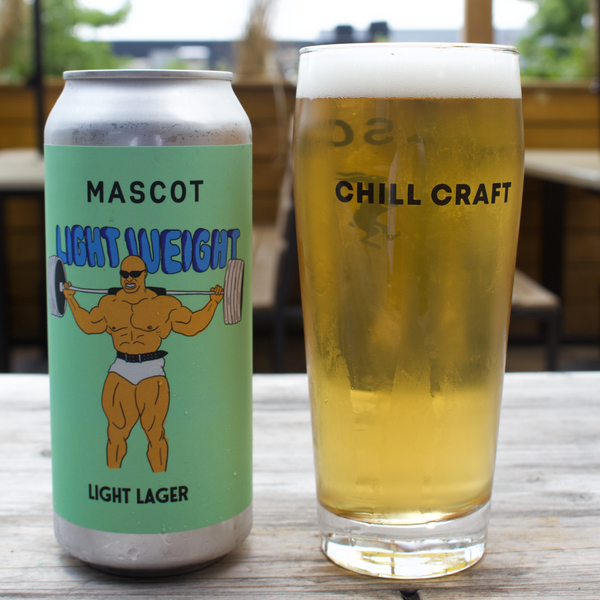 Can of lightweight lager by Mascot Brewery next to a filled up glass with the words "Chill Craft" branded on it.