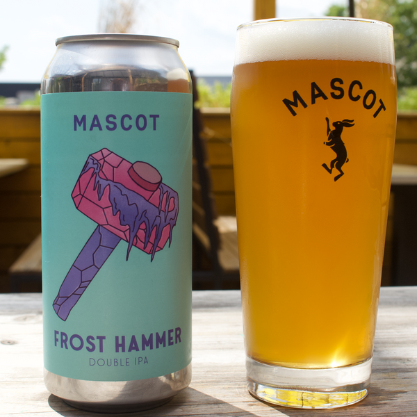 Can of Frost Hammer by Mascot Brewery next to a Mascot branded chilled glass filled up with beer.