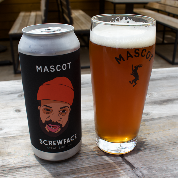 Can of Screwface by Mascot Brewery next to a filled up, Mascot branded beer glass.