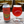 Can of Mascot Watermelon Beet Sour Beer next to a filled up, Mascot branded glass.